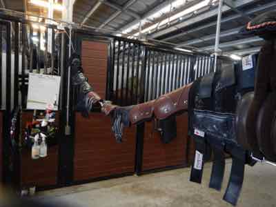 barn hack for hanging boots at a horse show