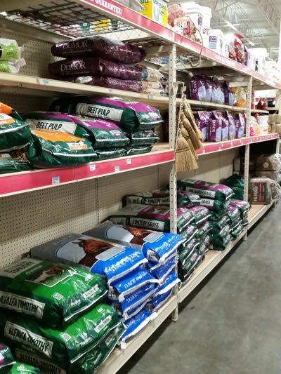 tidy shelves inside a feed store
